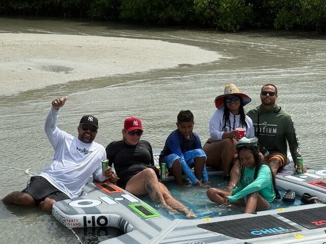 Family enjoying a custom private pontoon trip on the Treasure Coast
